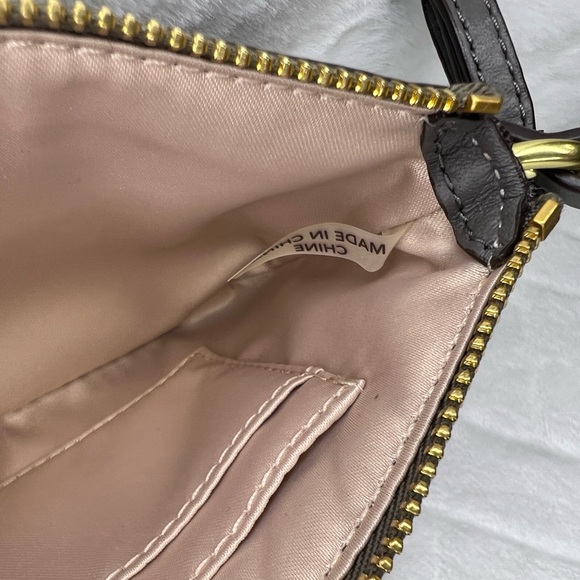 COACH POPPY SIGNATURE C SEQUIN SILVER/BURGUNDY WRISTLET NWOT - Picture 9 of 9